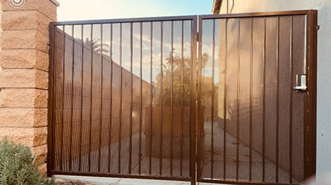 Custom fence and entry gate with keypad access installed by Alpha Fence Company
