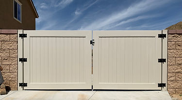 Vinyl gate complementing a fence line, installed by Alpha Fence Company