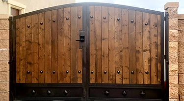 Custom wood gate built on site by Alpha Fence Company
