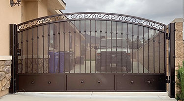 Wrought iron entry gate built by Alpha Fence Company